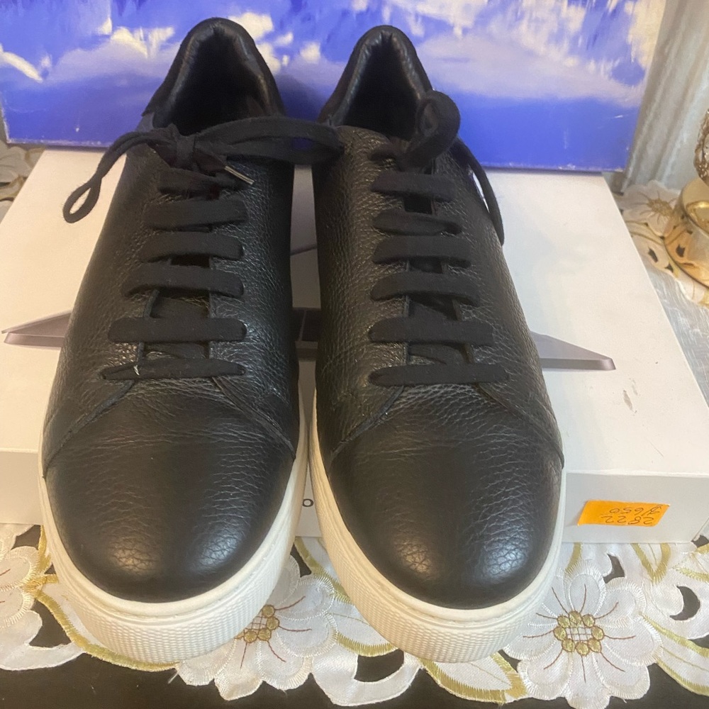 Paul Stuart black leather sneakers.